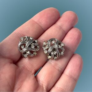 Signed vintage Crown Trifari silvertone swirl clip earrings w/ rhinestones
